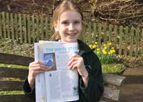 girl holding a newspaper