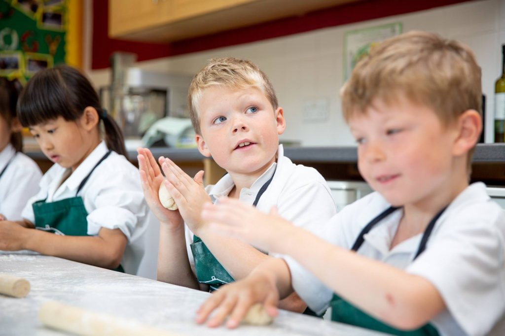 school children in food technology lesson