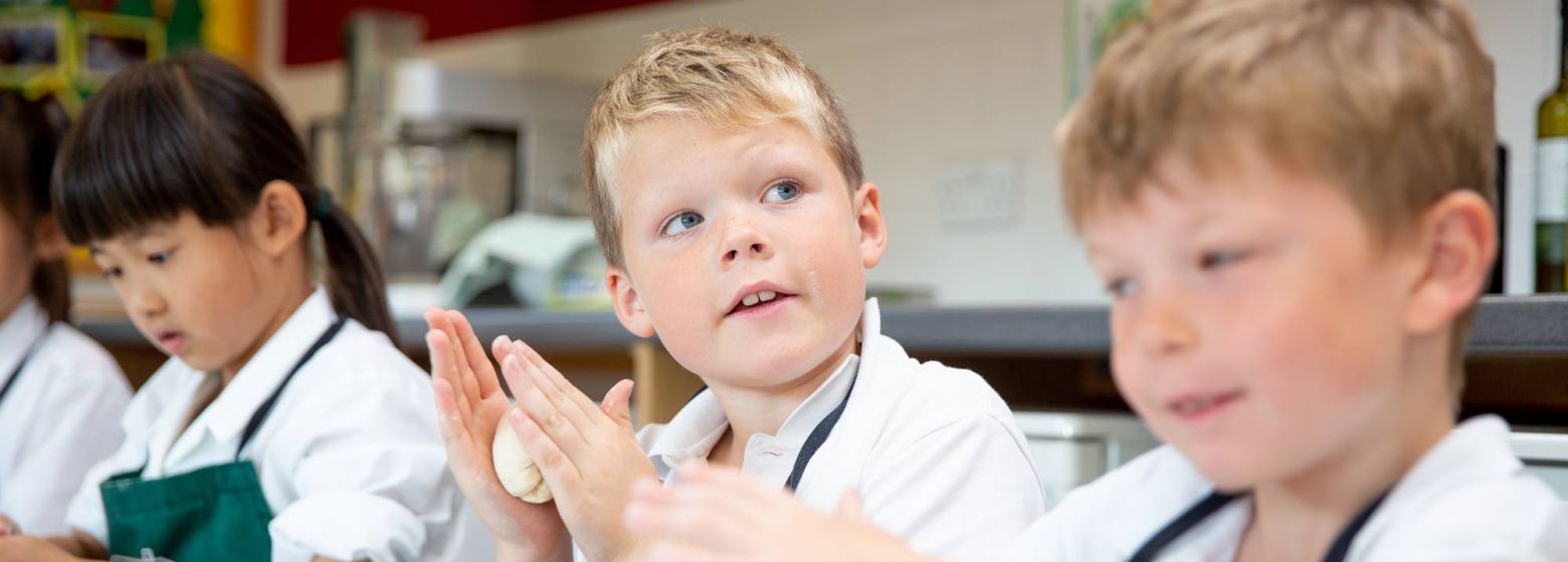 school children in food technology lesson