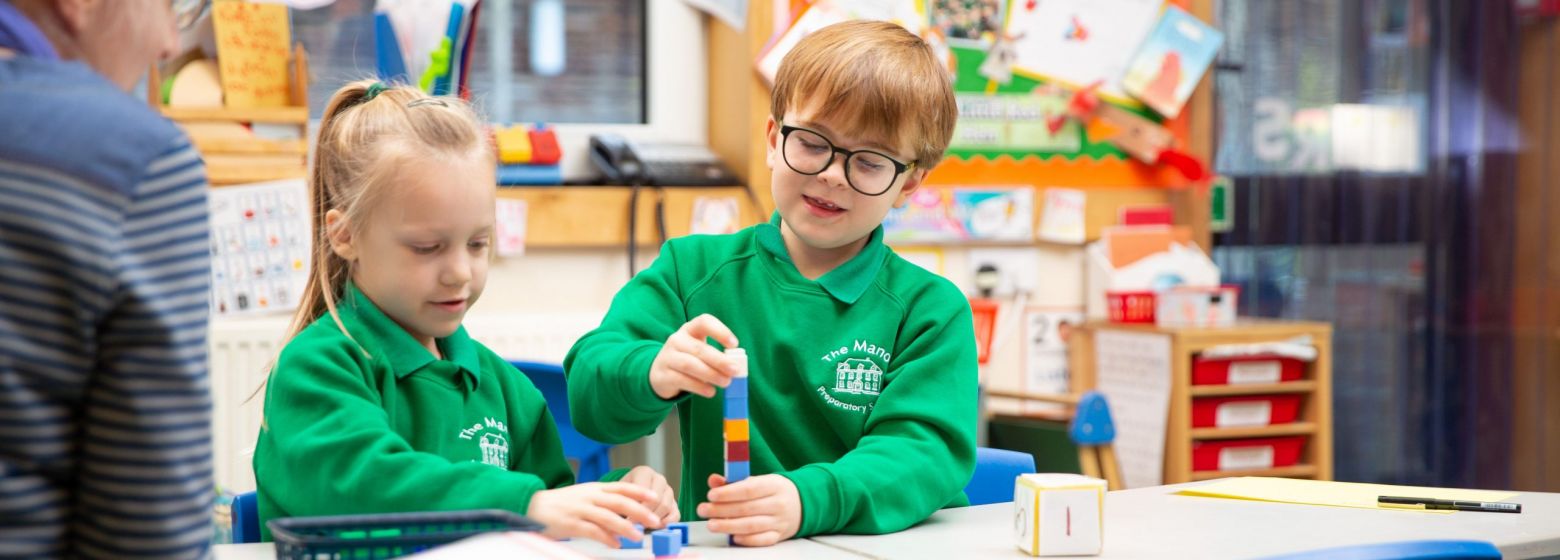 reception children playing with building blocks