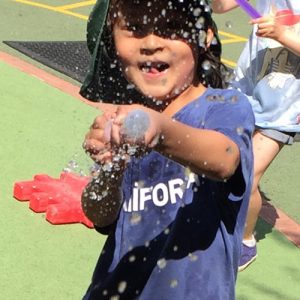 student getting soaked with water