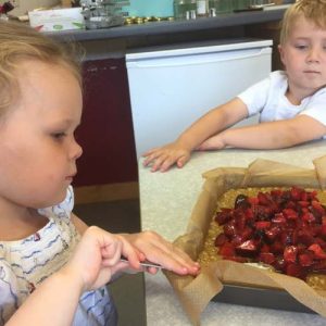 putting fruit into a tray