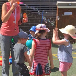 Students catching bubbles