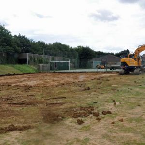 machine digging up soil