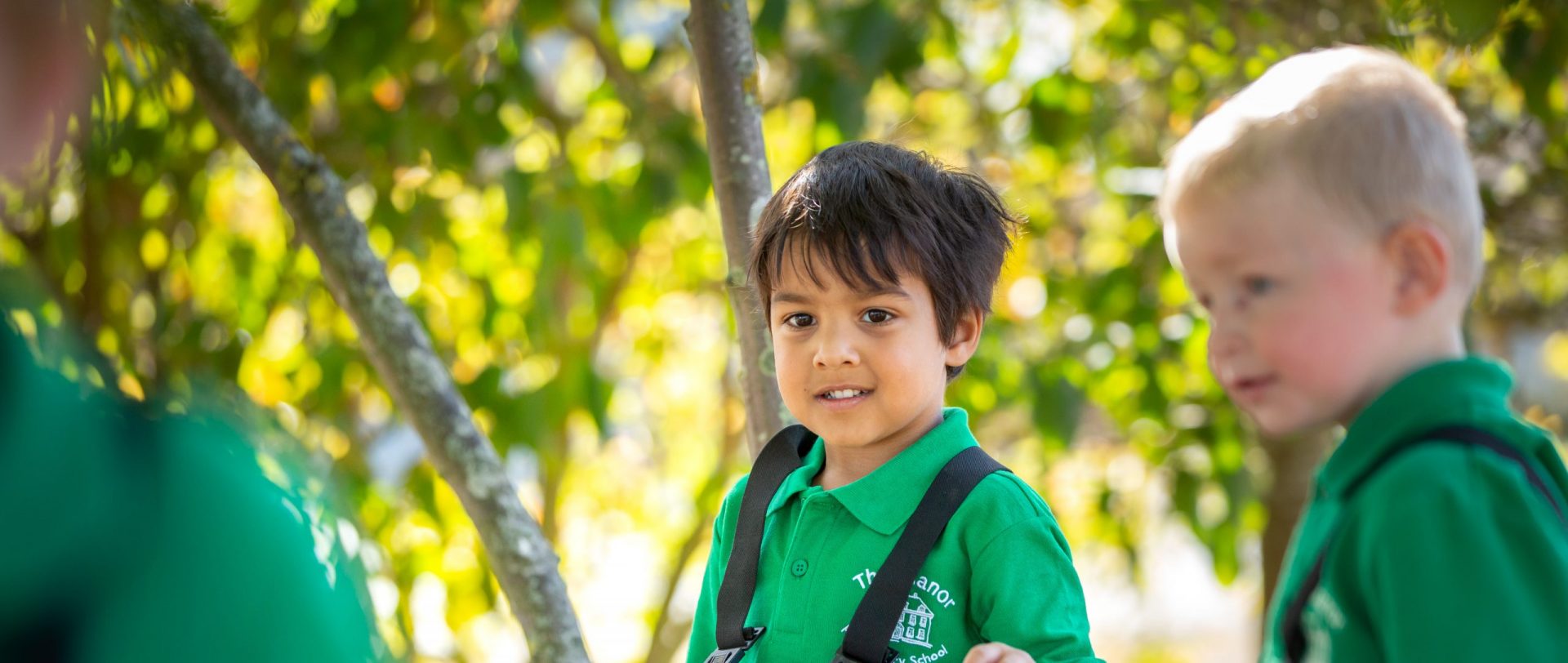 nursery aged children learning outdoors