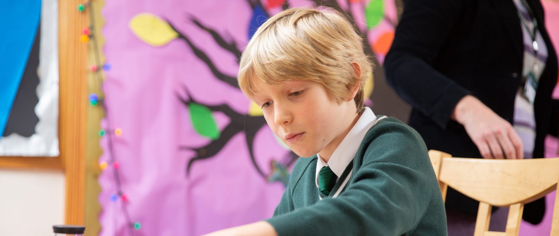 child using small coloured building blocks