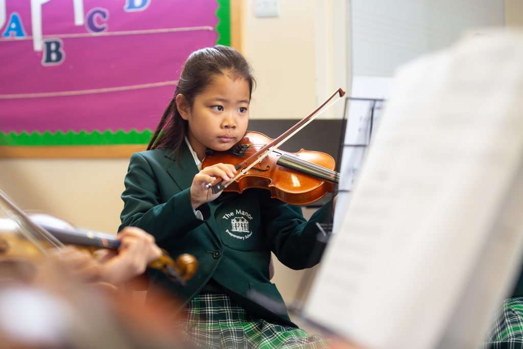 Prep student playing violin