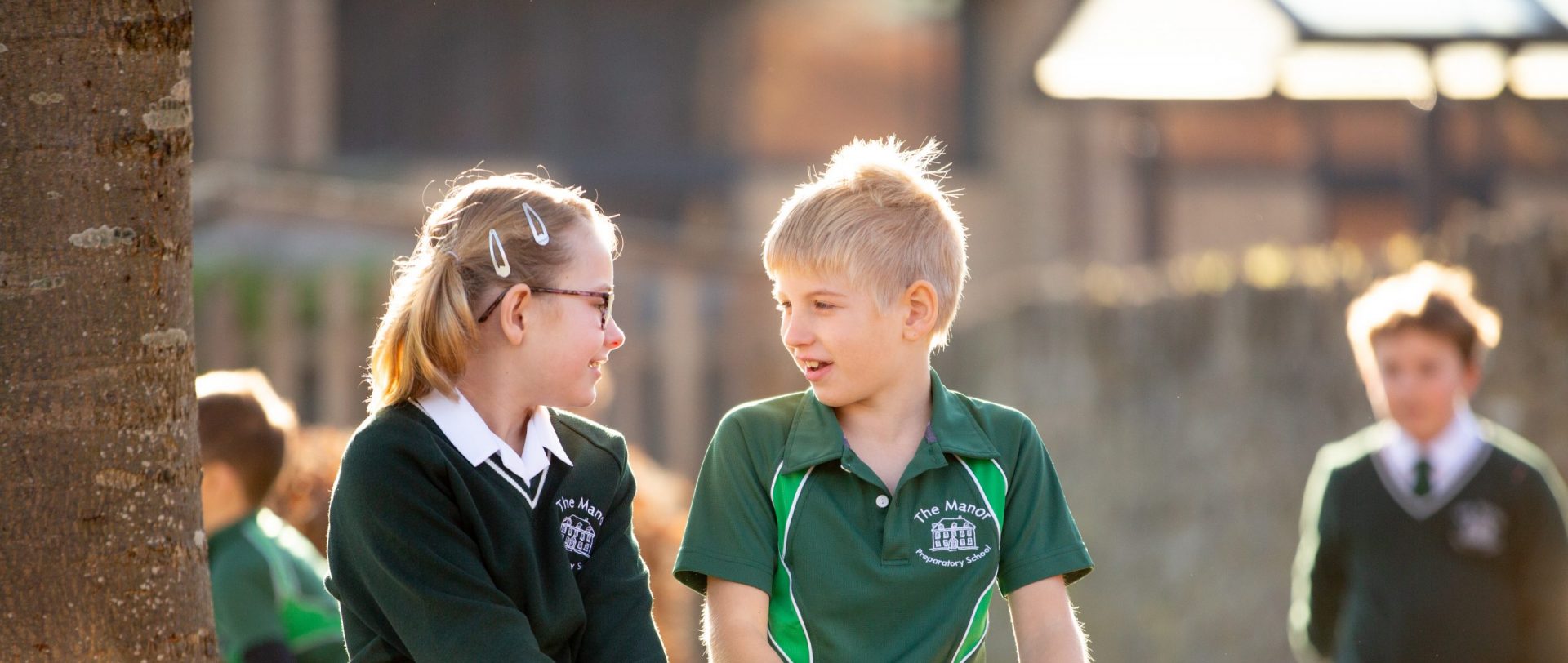 2 Manor Prep students having a conversation outside