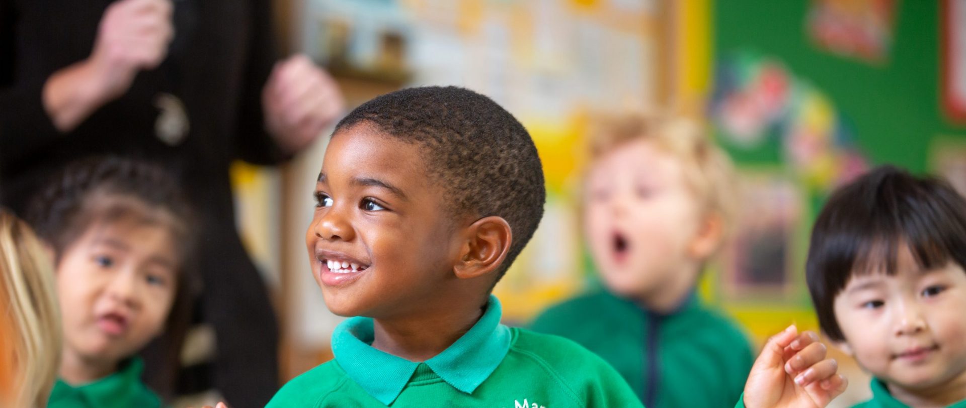 Young Manor Early Years student smiling and dancing