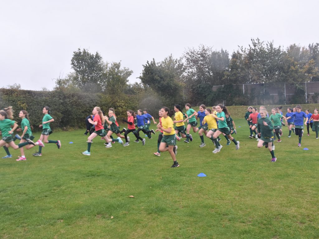 students running across the field