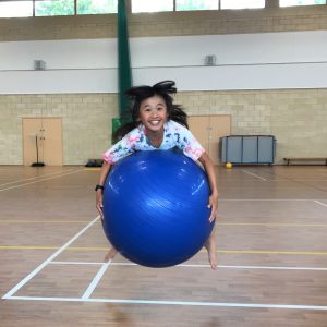 student with a Swiss ball