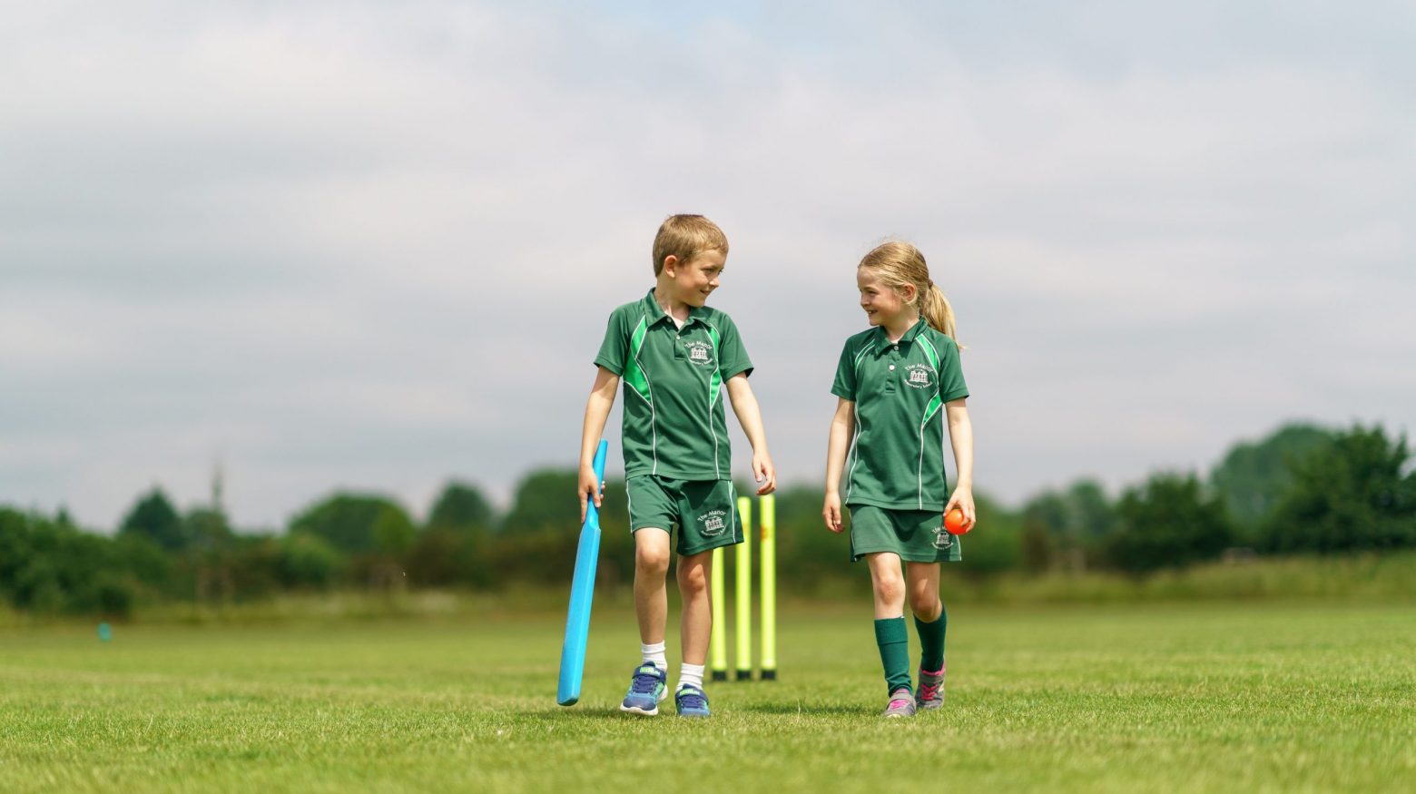 students playing cricket