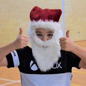 student with Santa Hat and Beard on face