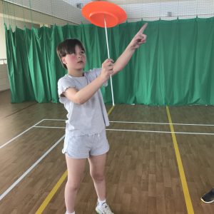 Student with racquet in hand