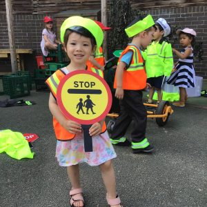 Child holding a crossing sign