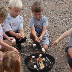 children having roasted marshmallow