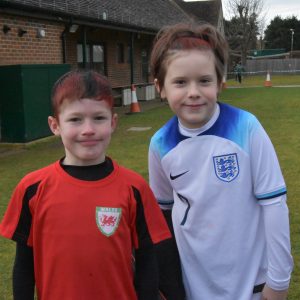 2 students in football gear