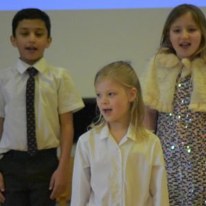 3 students singing