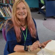 lady signing a book