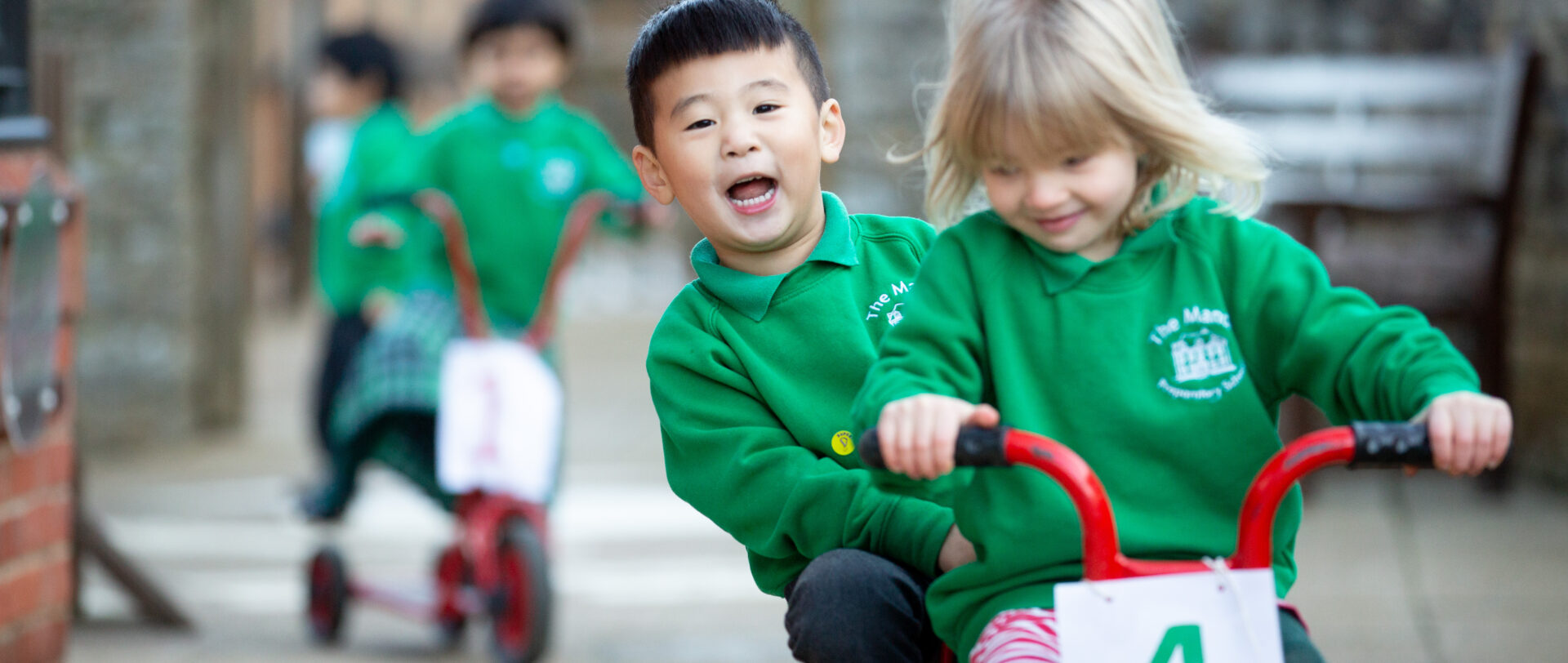 2 young students riding on a bicycle