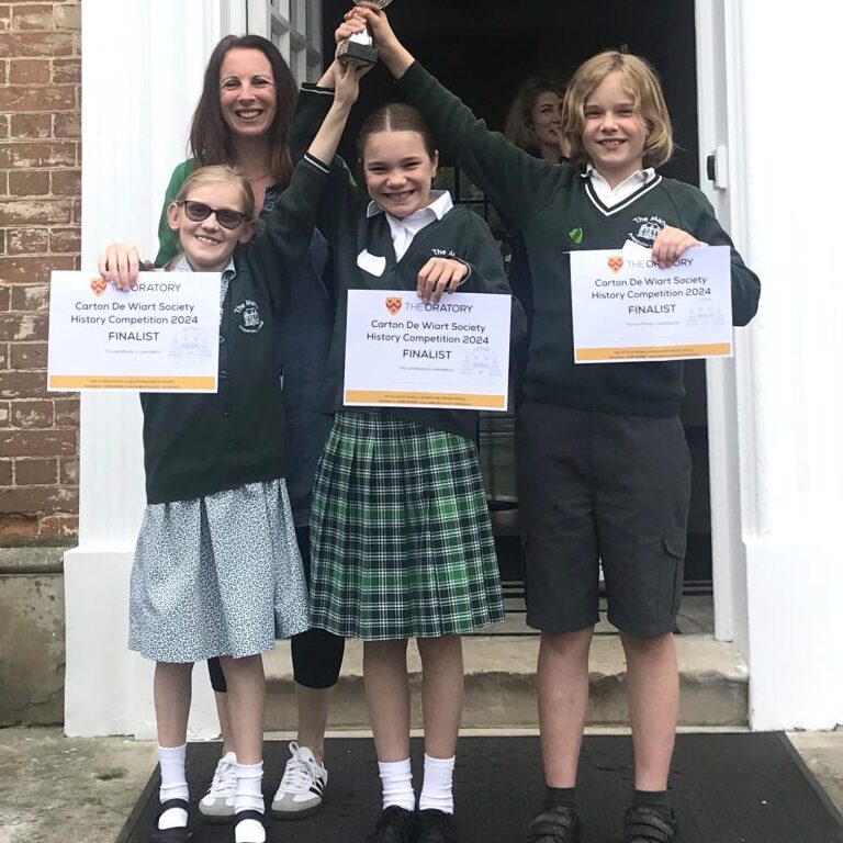 students holding trophies