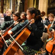student playing stringed instruments