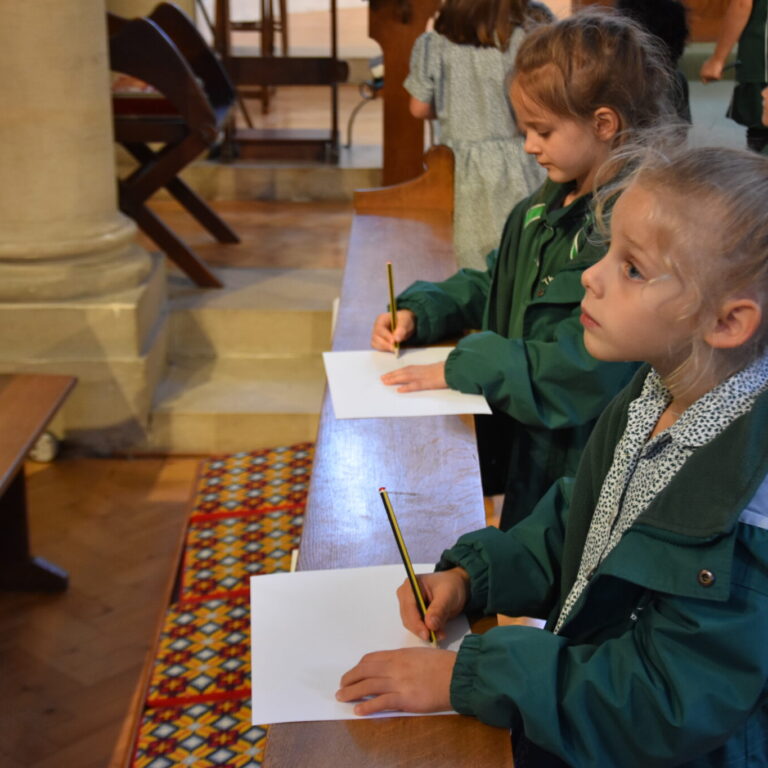 students writing on paper