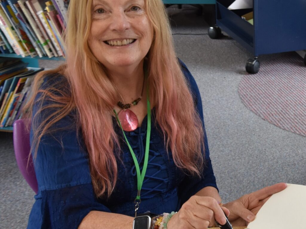 lady signing a book